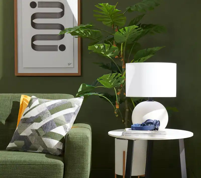 Table d'appoint ovale moderne Nico 56 cm Kort & Co. – Plateau en pierre frittée blanche, pieds en métal gris foncé, résistant aux rayures et aux taches